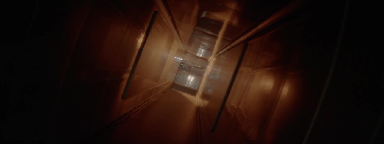 Hallway with brown floor ceiling and walls