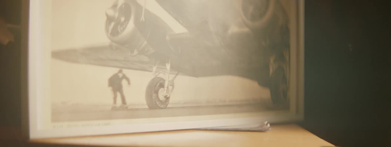 Picture of an airplane and a person underneath it