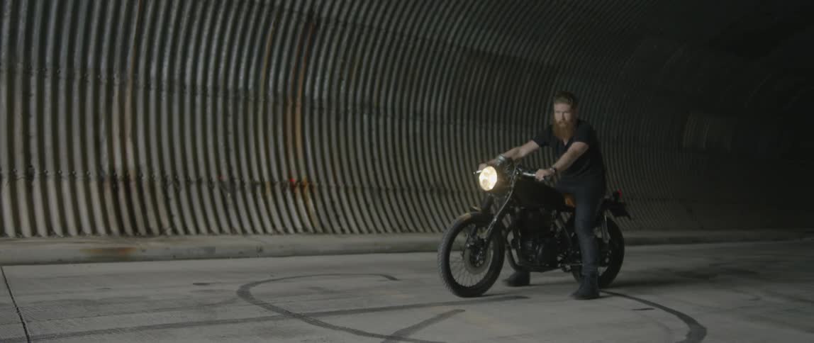A man prepares to ride his bike