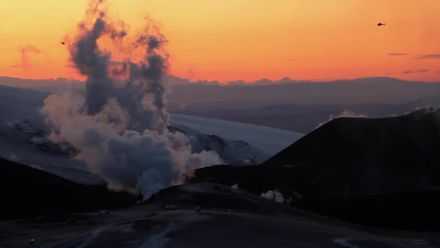 Smoke pours out of a volcano
