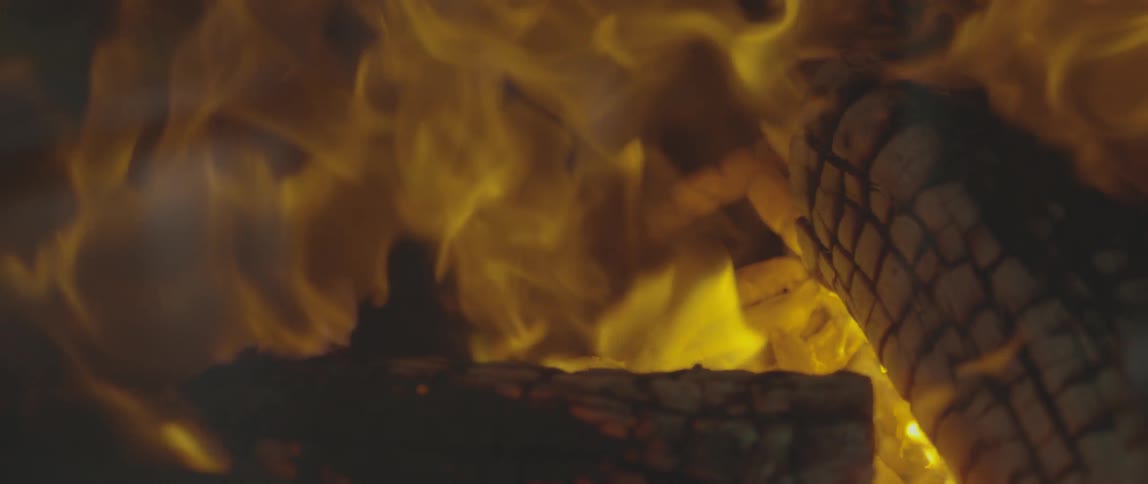 A fire is burning wood