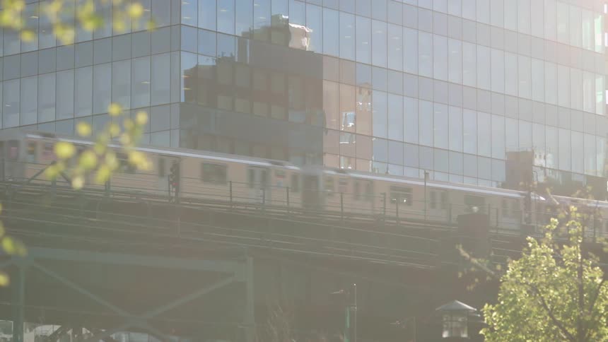 A commuter train passes on a bridge