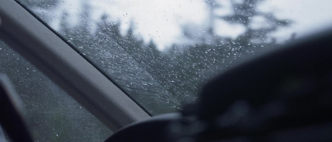 A car is driven in the rain