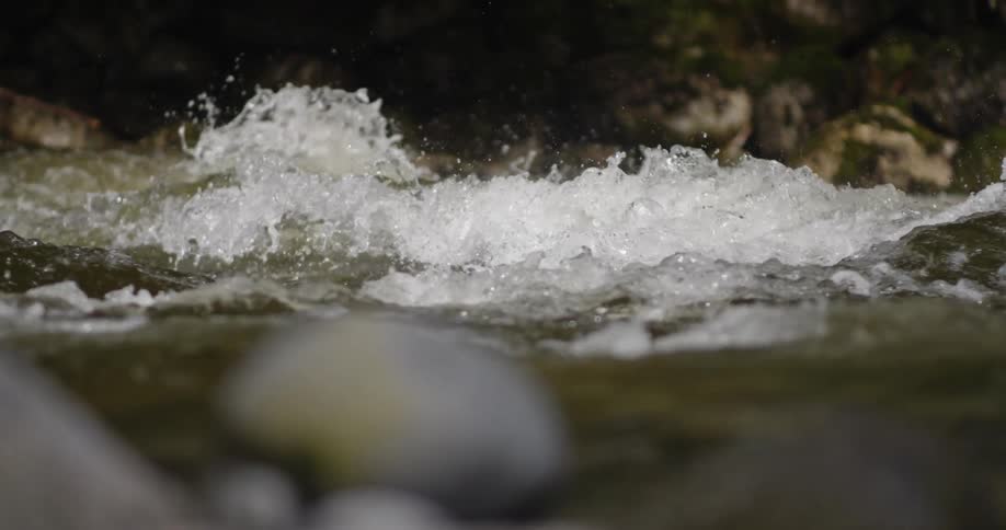 The rapid waters move fast splashing all over