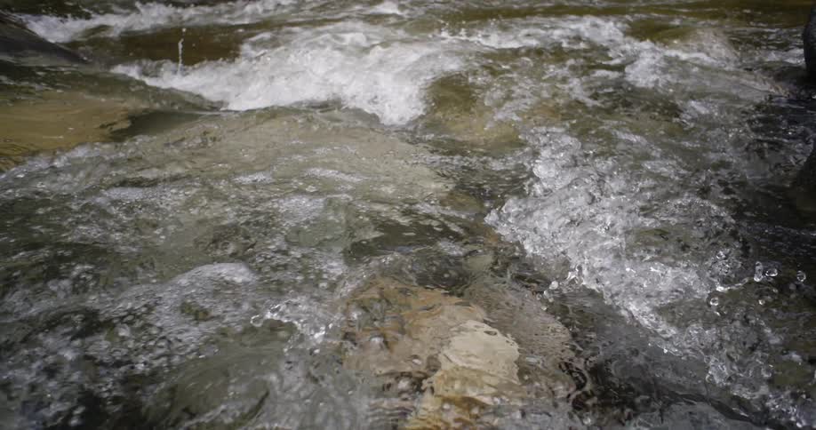Water splashes together in all different directions