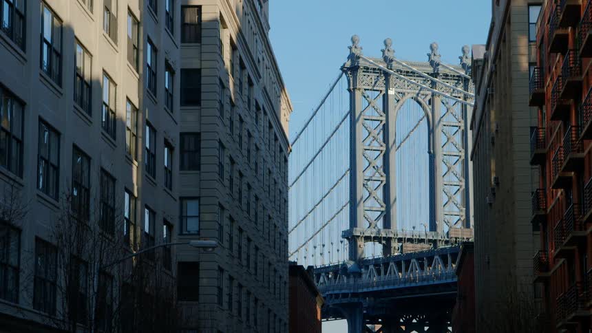 The cars travel over the bridge in the city
