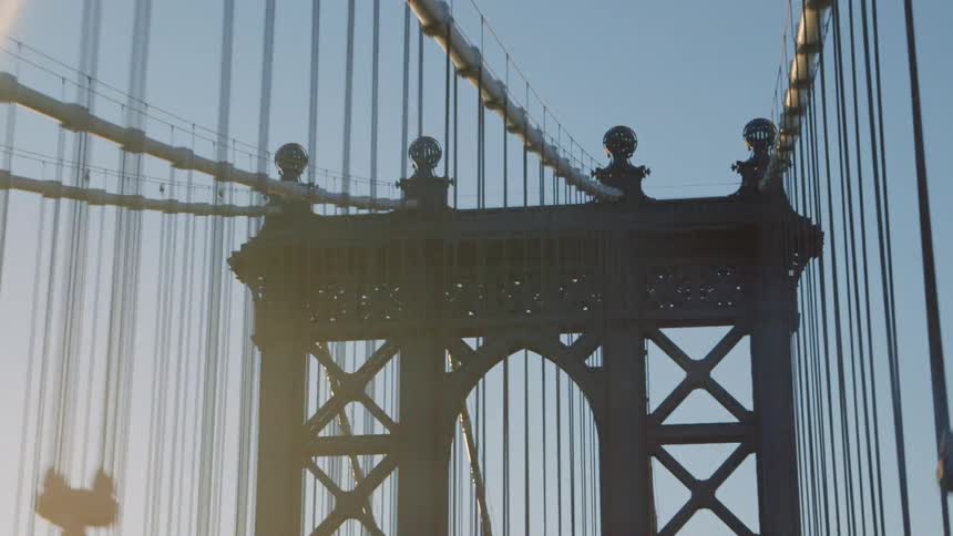 Sunlight is shining down on a bridge on a sunny day