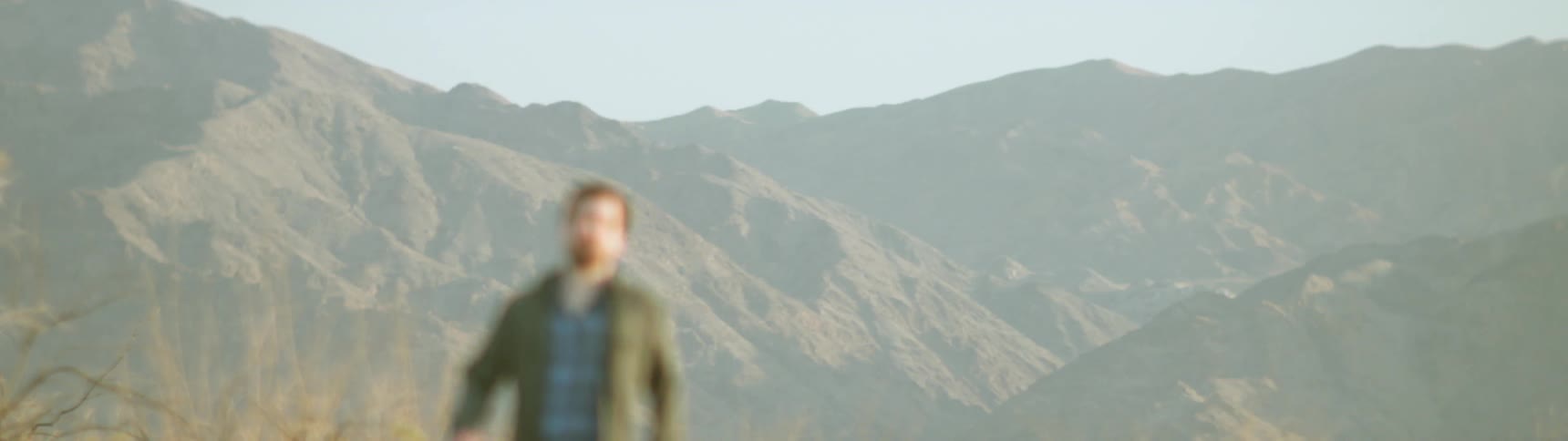 A man walks outside under the sun