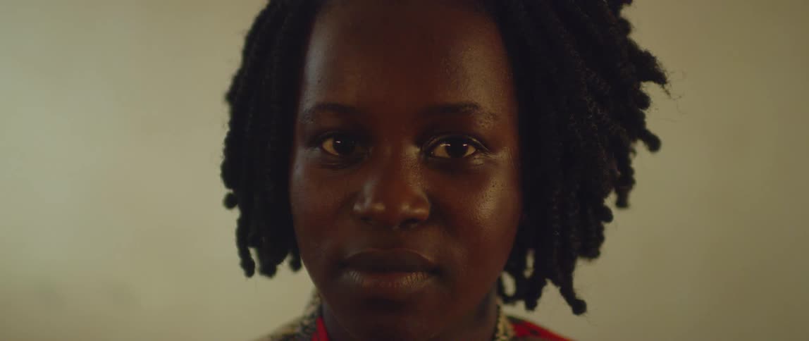 A woman stares forward