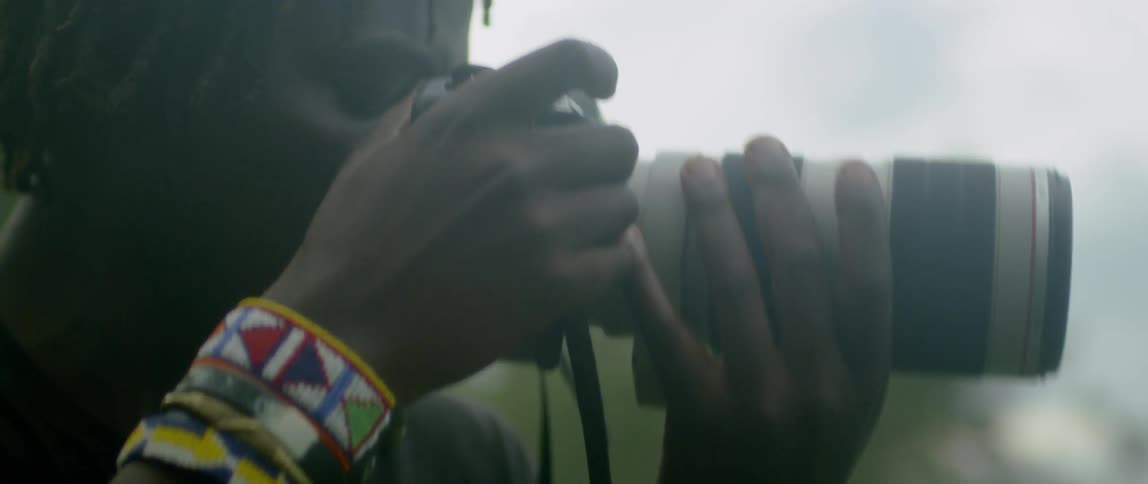 Person takes pictures outside with a camera