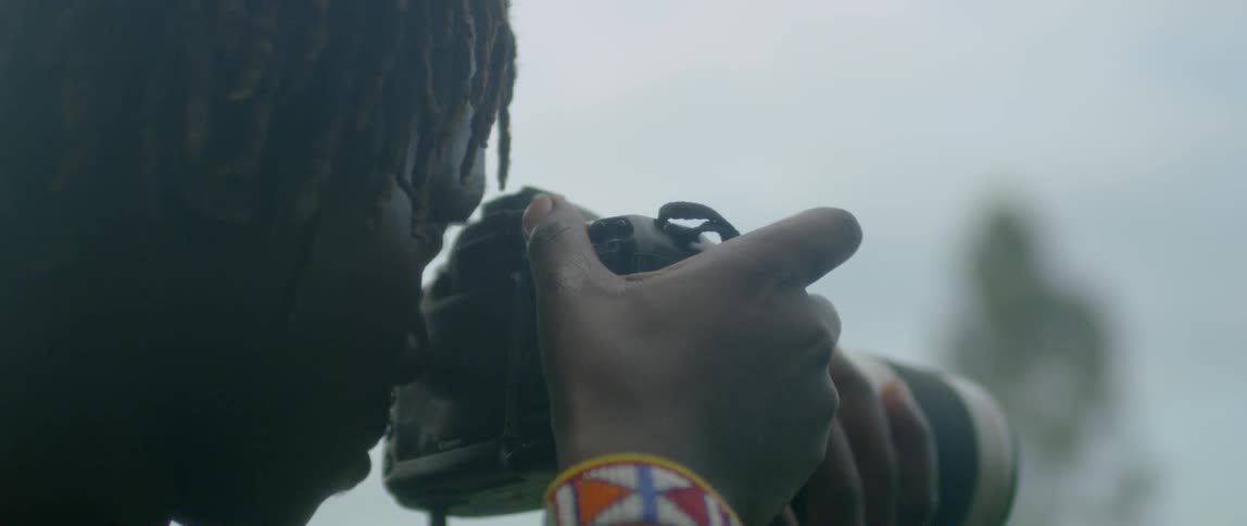 A man takes photographs of nature