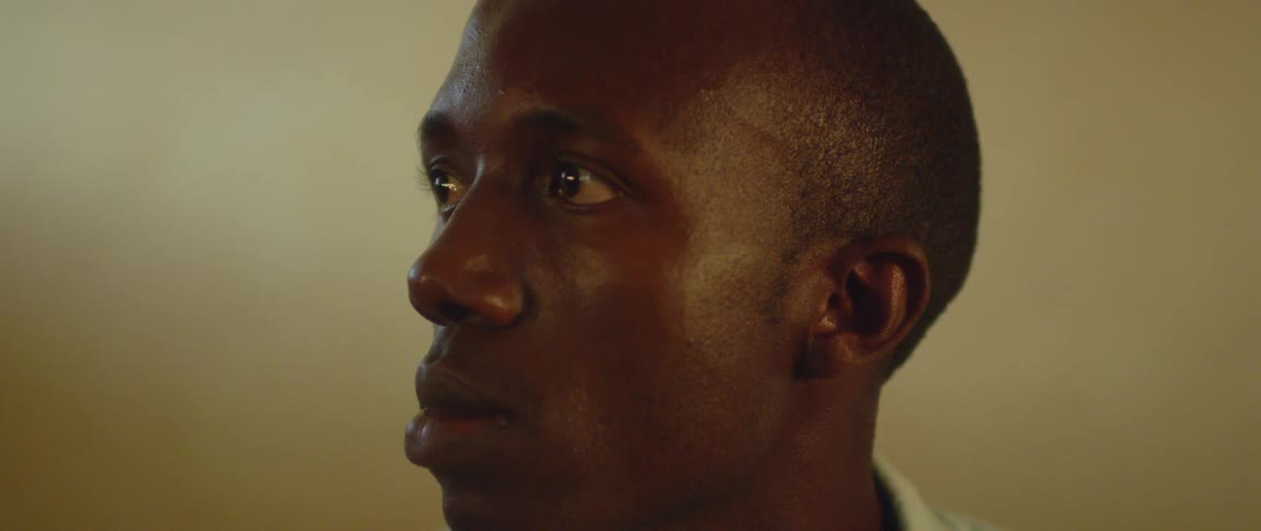 A man stares to his side