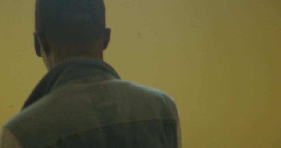 A man walks down a staircase