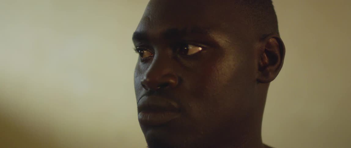 A man stares to the side