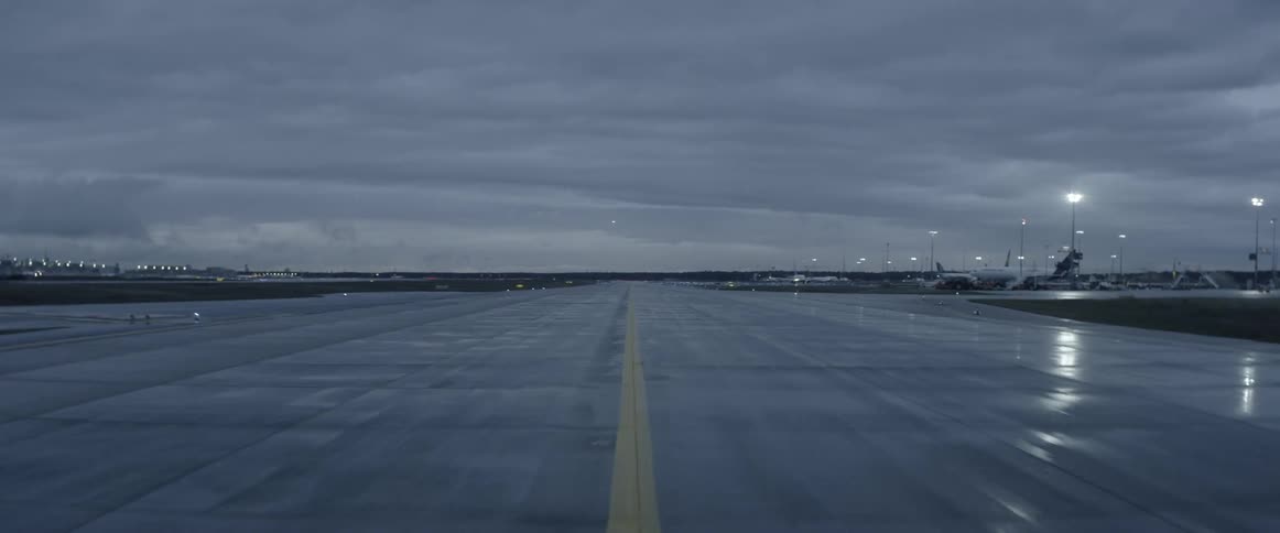 The yellow line on a runway on a cloudy day