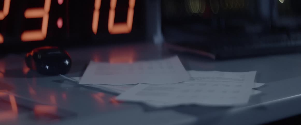 A paper falls onto a desk