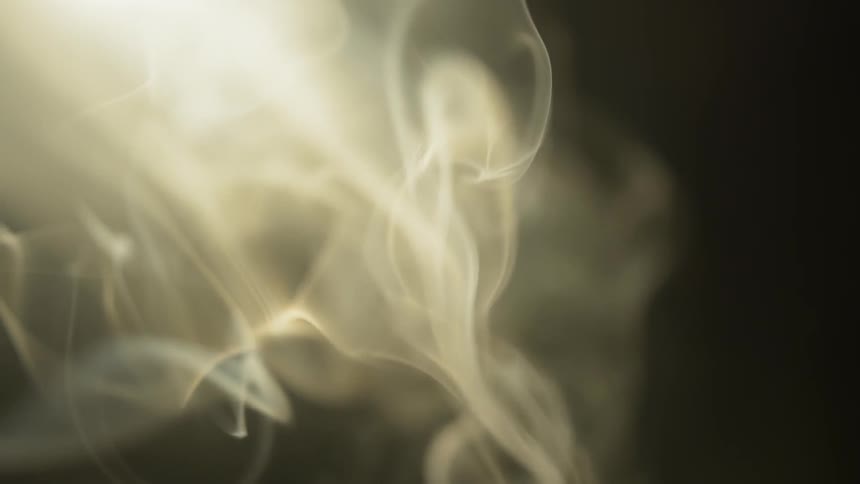 Smoke is twirling and curving in the air