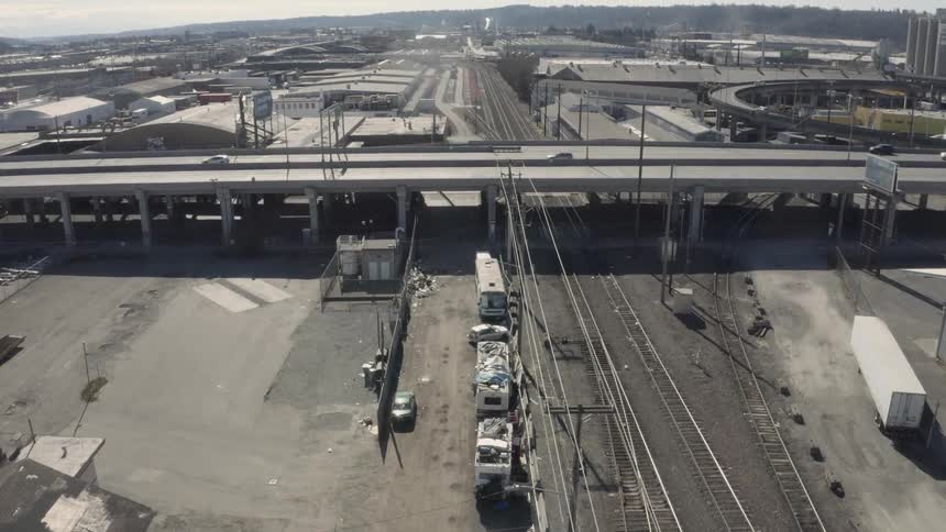 Cars crossing over bridge on city highway