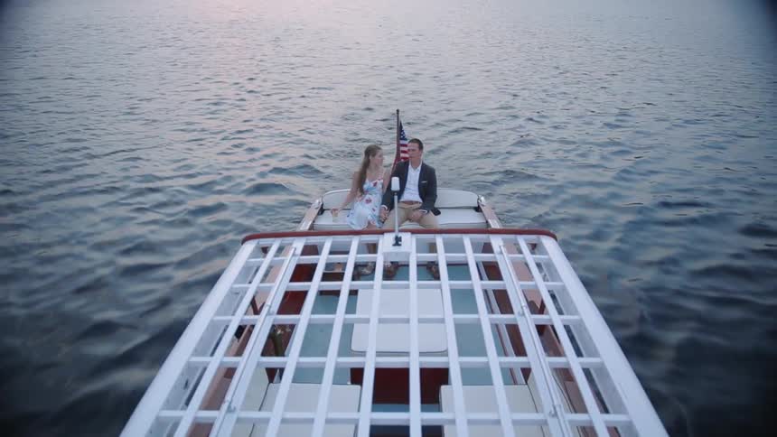 A couple is riding on a boat
