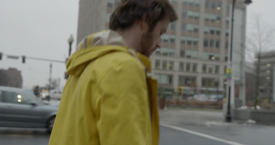 A person is walking in the rain