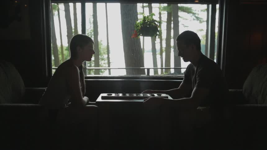 A couple play games in their house