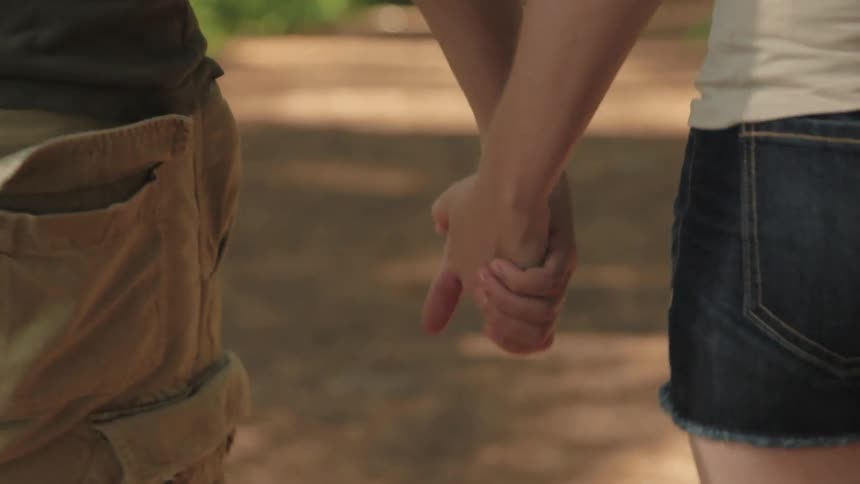 A couple is walking down the road