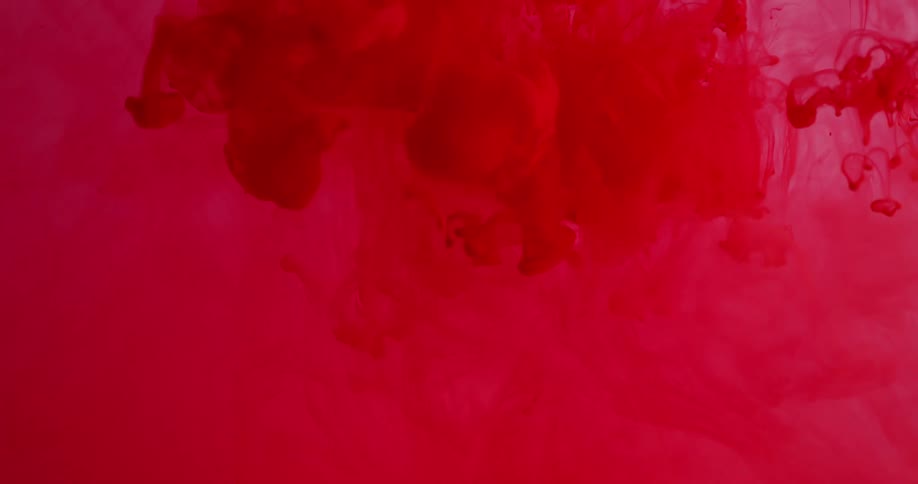 Red liquid mixes into clear liquid