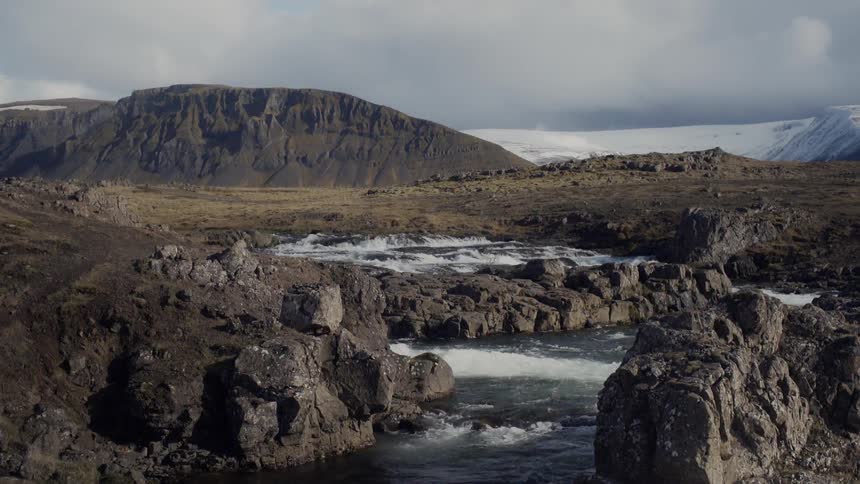 Water flows through rocky hilly land