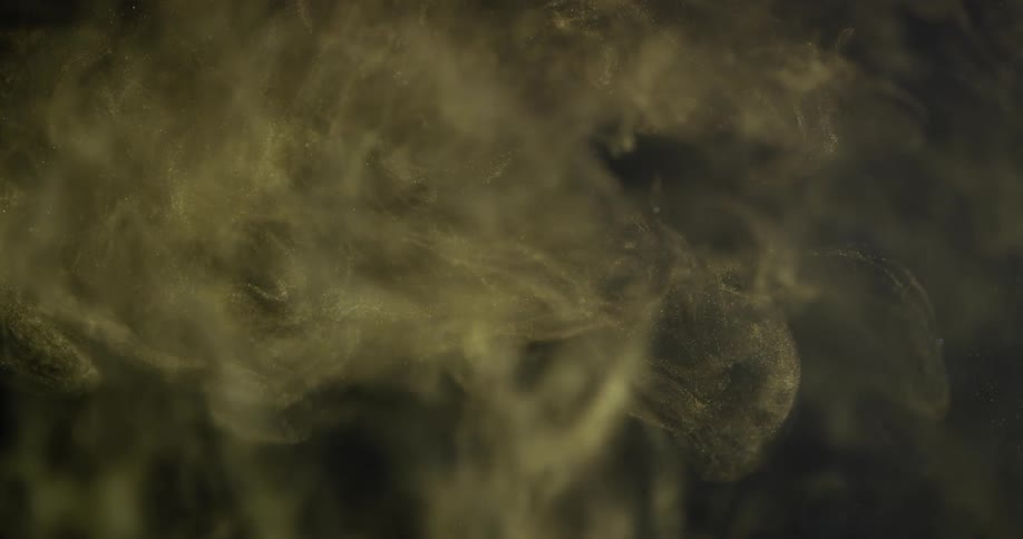 The smoke swirls in the very dark room