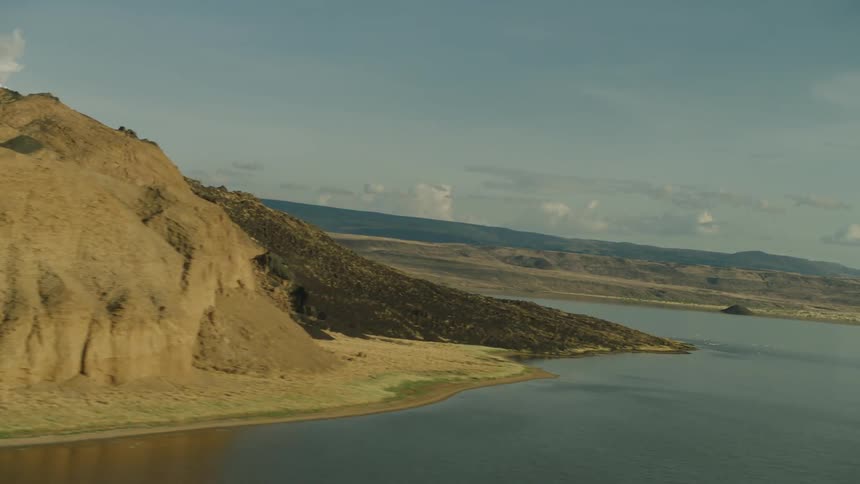 River flows though hills and plains