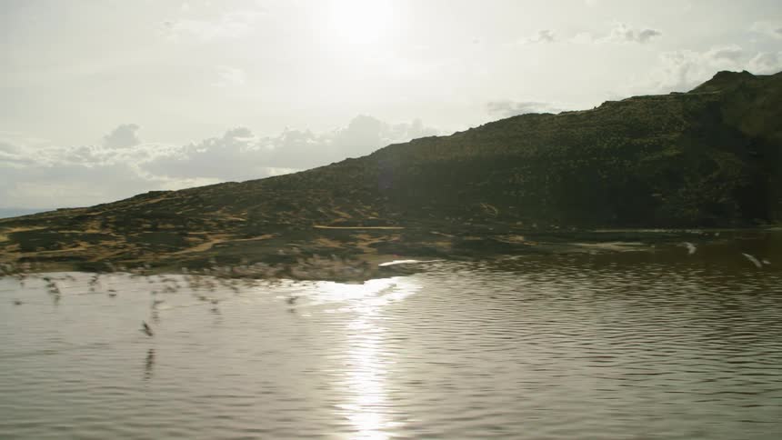 A small rocky island is sitting out of the ocean