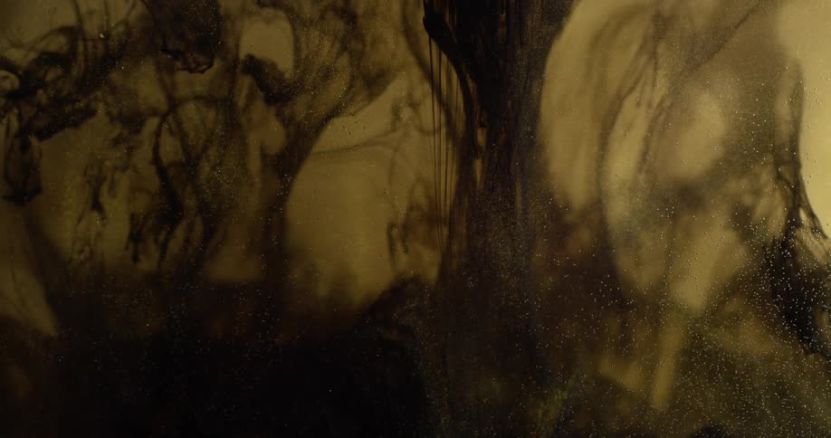 Black dye expands and sinks in liquid
