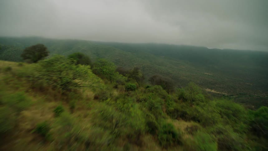 The hills below are covered with green