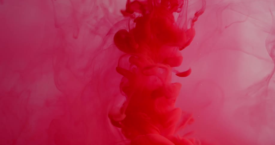 Red liquid splashes down into clear liquid