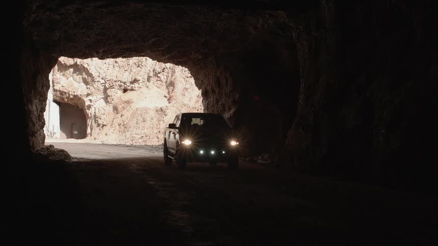 Car drives through a tunnel