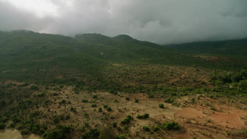 Thick clouds hovering over mountain wilderness