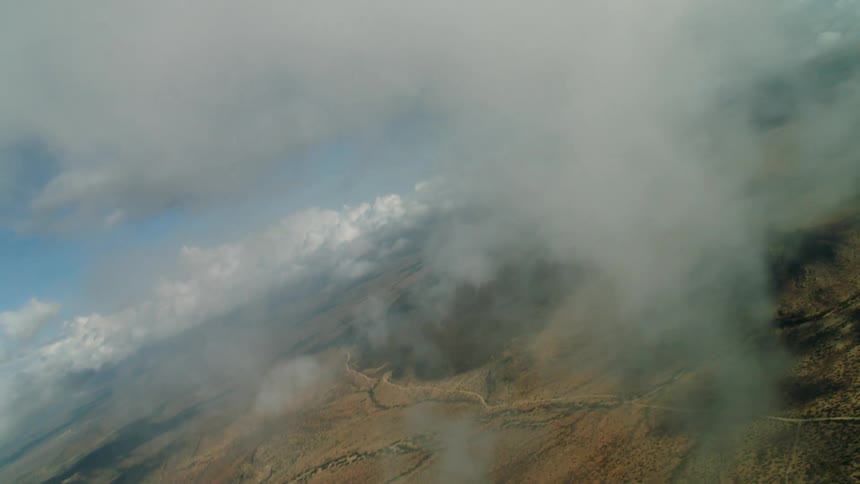 White clouds hang over the landscape