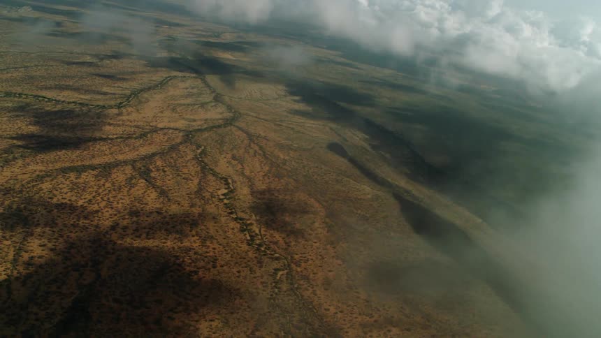 Clouds are drifting over a river basin in daylight