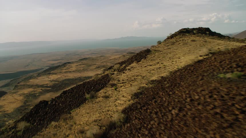 A landscape of brown hills and peaks