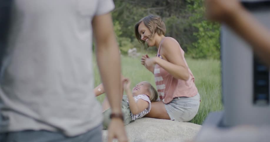 Parents play with their children in nature