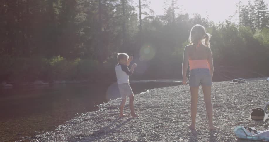 The children play together by the stream