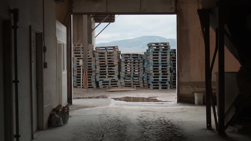 Pallets stacked outside of a building