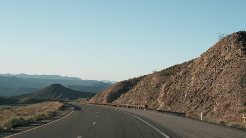 Road winds through hilly country