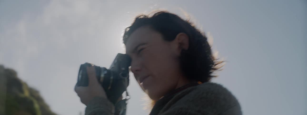 Women is outside taking photographs on sunny day