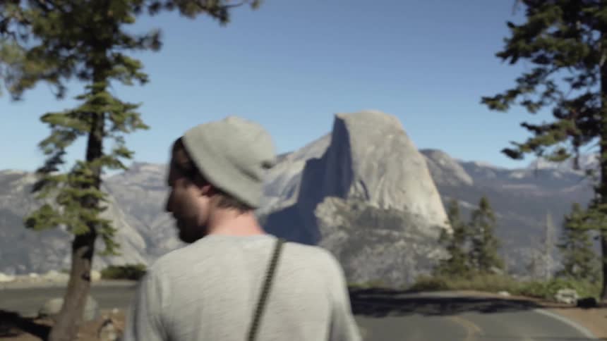 A man hikes in mountains