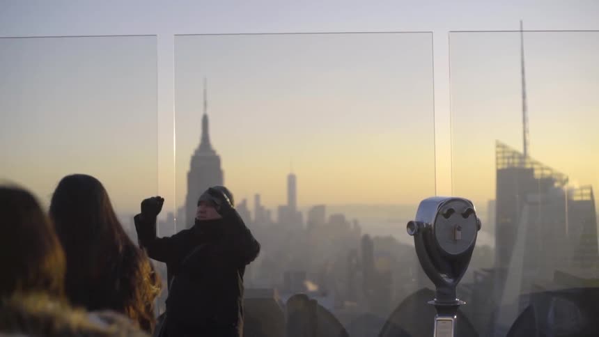 People are looking off an observation deck