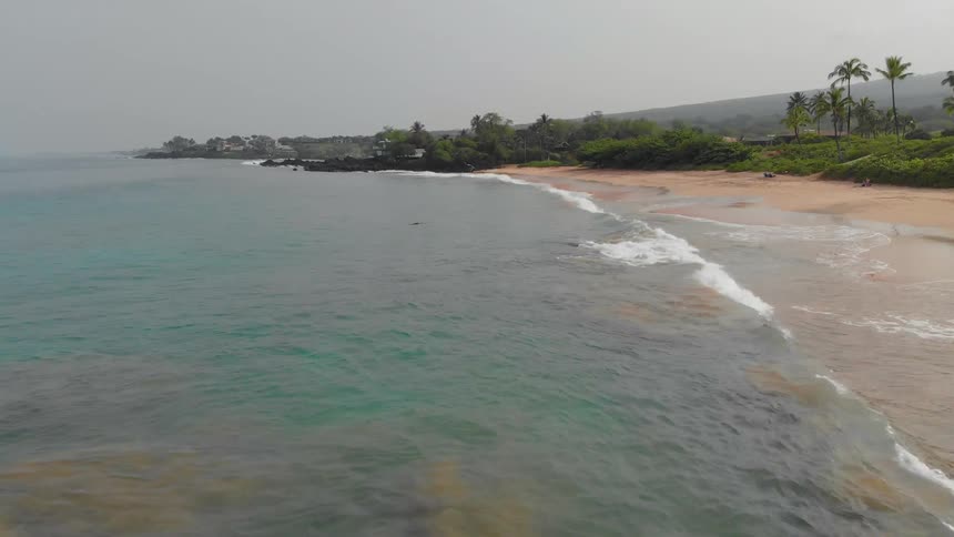 Ocean waves crash to shore