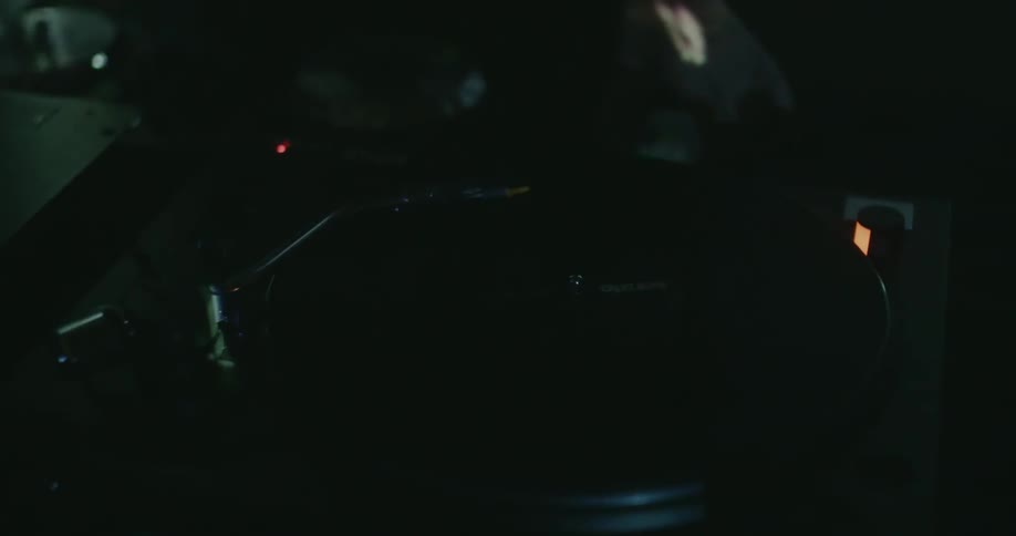Lights flash around a spinning record