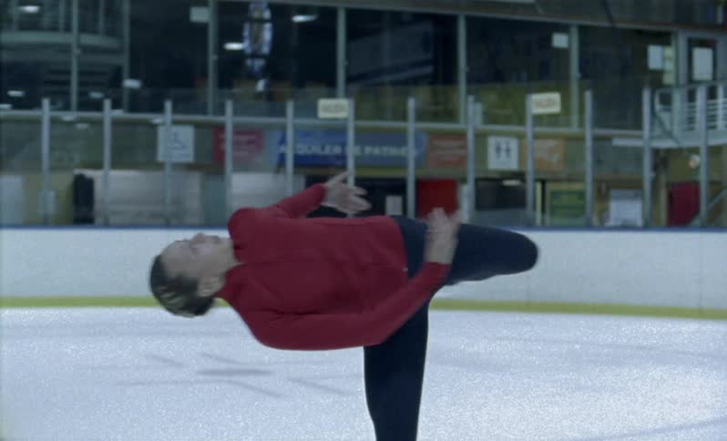 A figure skater spins on the ice