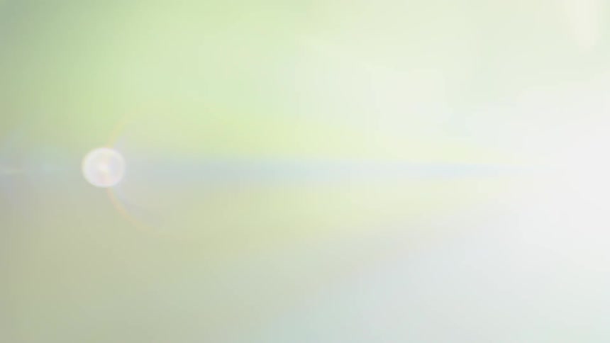 A projector shines through foggy air